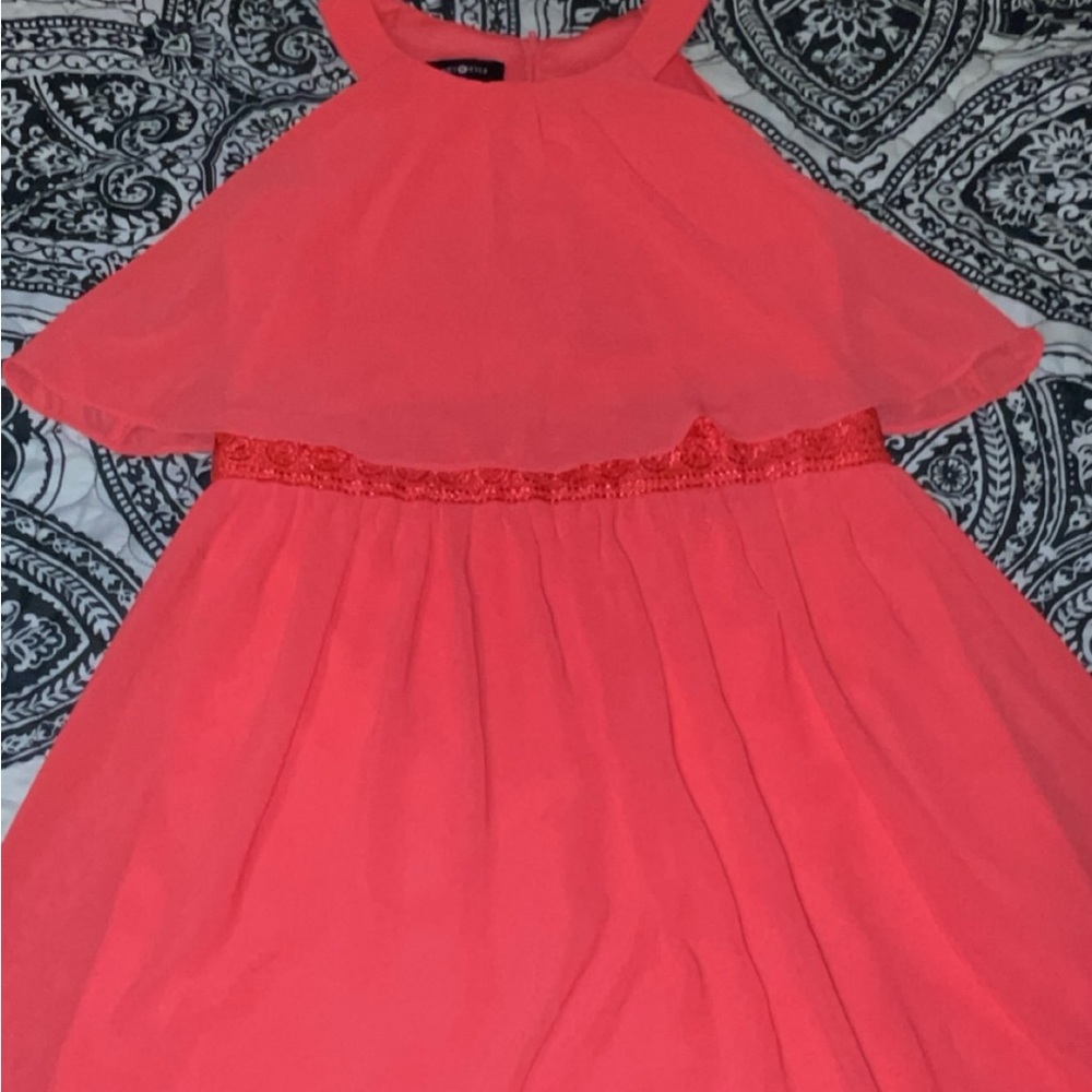 a peachy color dress